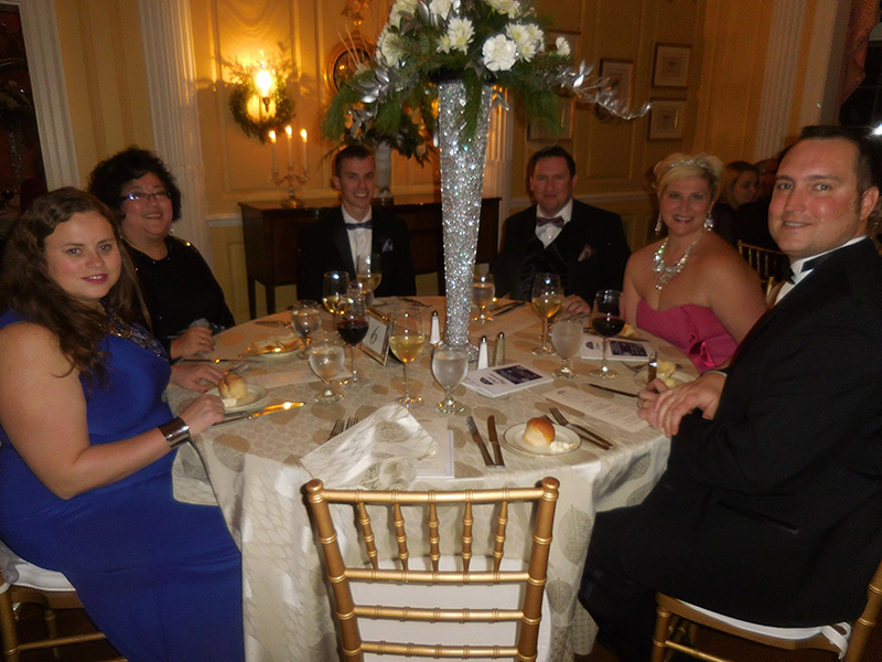 attendees sitting at table during 2016 elegant progressions